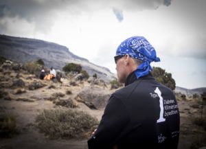 Dr. Michael Riddell climbing Mt. Kilimanjaro with other people with T1D